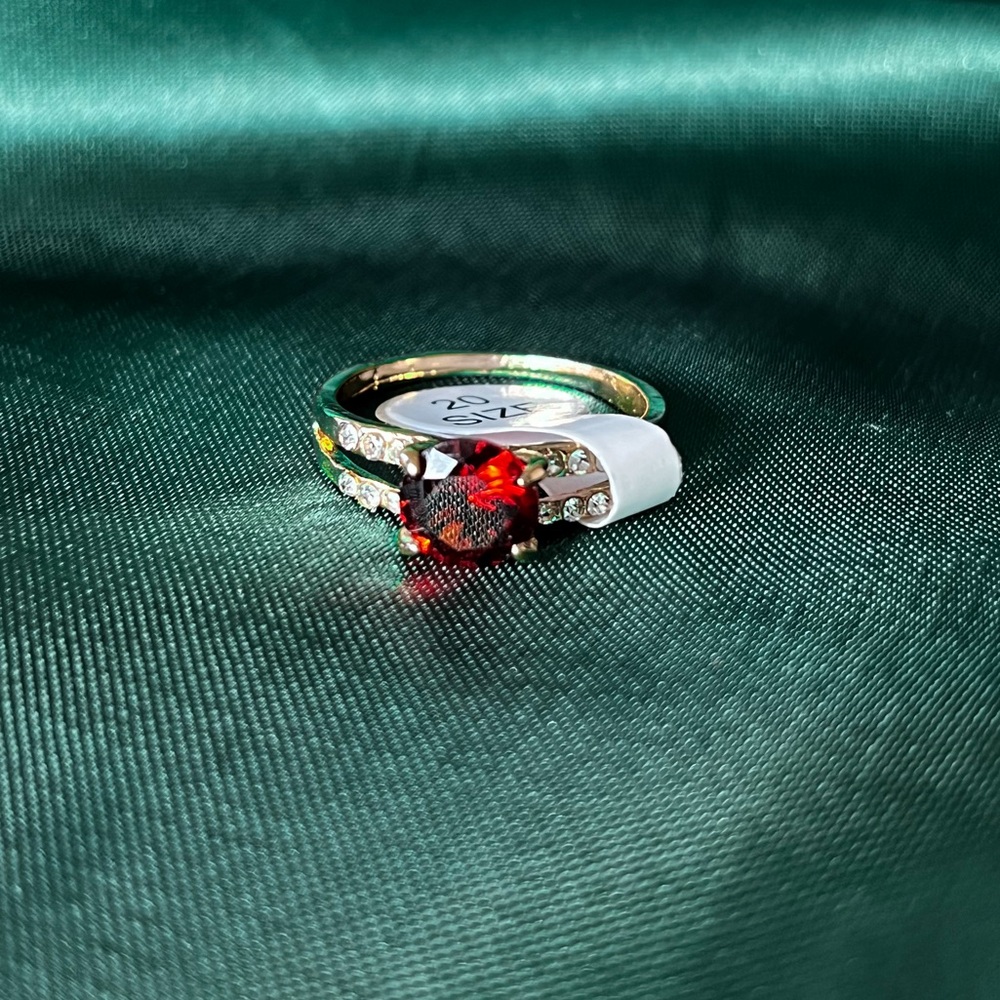 Gold Alloy Ring With Clear And Red Gems